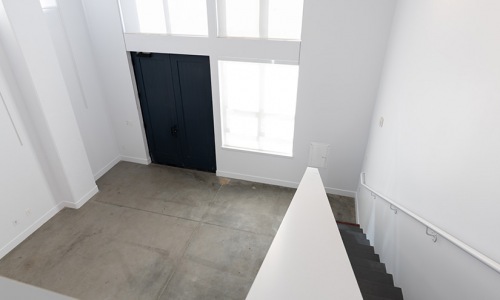 loft view of main floor entrance with large windows